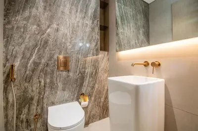 a bathroom with a white toilet and a sink at Luxury 1 BHK in Dubai Marina JVC 904 in Dubai
