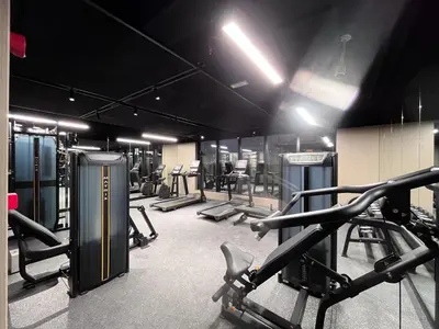 a gym with several treadmills and machines in it at Luxury 1 BHK in Dubai Marina JVC 904 in Dubai