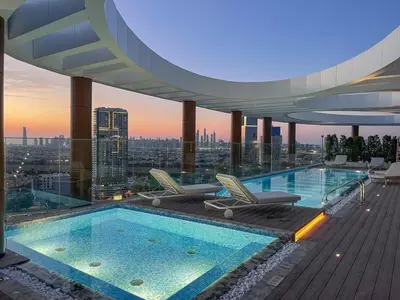 a pool on the roof of a building with a view at Luxury 1 BHK in Dubai Marina JVC 904 in Dubai