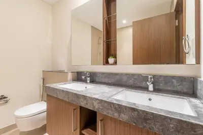 a bathroom with a sink and a toilet at Luxury 2 BHK in Jumeirah By dPie Emaar 2008 in Dubai