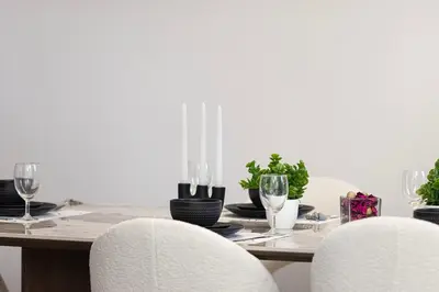 a dining room table with two white chairs and a table with glasses at Lux 4BHK in JBR 5 Mins Walk to Beach Sadaf 8 102 in Dubai