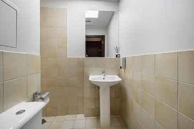 a bathroom with a sink and a mirror and a tub at Lux 4BHK in JBR 5 Mins Walk to Beach Sadaf 8 102 in Dubai