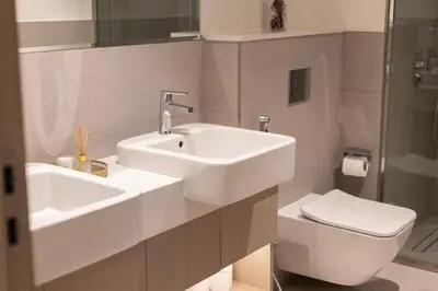 a bathroom with a sink and a toilet at Luxury Villa in Jebel Ali Village By dPie in Dubai