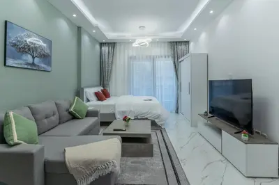a living room with a couch and a bed at Dubai Marina - Perfect Studio Apartment in Dubai