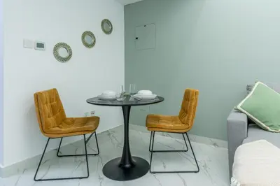 a table and two chairs in a room at Dubai Marina - Perfect Studio Apartment in Dubai