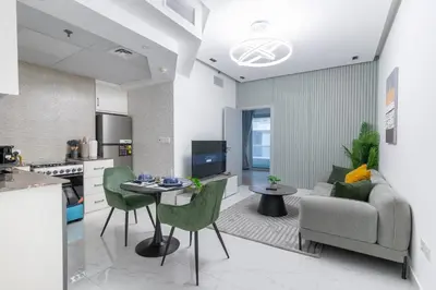 a living room with a couch and a table at Dubai Marina - 1BHK Modernistic Apartment in Dubai