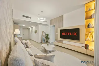 a living room with a couch and a television at Plush Winter Stay 1BR Park Tower DIFC & Museum in Dubai