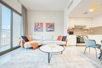 a living room with a couch and a table at Keysplease Great Family 2 BR Apt, Townsquare in Dubai