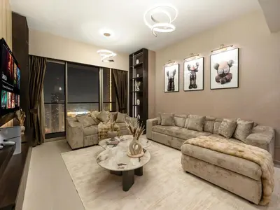 a living room with a couch and a table at 51st Floor Sea and Skyline Views LUXE 1BR in Dubai