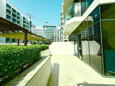 a walkway next to a building in a city at Luxury studio appartment in Sabkhah