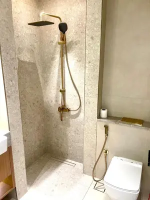 a bathroom with a shower with a toilet in it at Premium Stylish Studio in JVC in Dubai