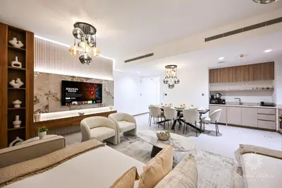 an open living room with a dining room and kitchen at Luxury Apartments - Urban Oasis by Missoni - Business Bay - Canal View - 10 Minutes from Dubai Mall Burj Khalifa in Dubai