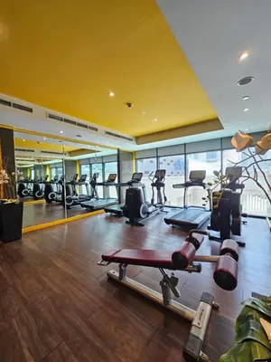 a gym with treadmills and cardio equipment in a building at Merano Studio 920 in Dubai