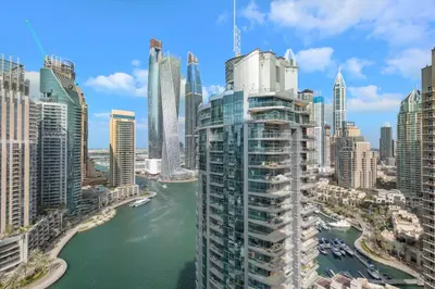 a view of a city with a river and buildings at Luxury 4BR w Marina Views Near Beach & Mall in Dubai
