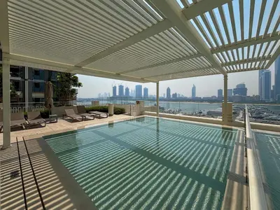 a swimming pool on the roof of a building at Frank Porter - Marina Vista in Dubai
