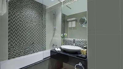 a bathroom with a sink and a shower at Panoramic Burj Khalifa View - Damac Distinction Downtown Dubai in Dubai