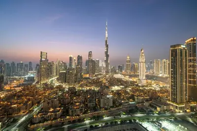 a view of a city at night at Panoramic Burj Khalifa View - Damac Distinction Downtown Dubai in Dubai
