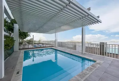 a swimming pool on a balcony with a view of the ocean at Luxury Stay, 3BR Palm View, Beach Vista in Dubai