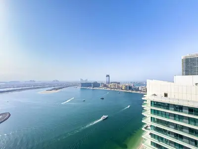 a view of a river with boats in it at Luxury Stay, 3BR Palm View, Beach Vista in Dubai