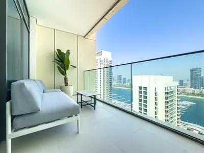 a living room with a couch and a large window at Luxury Stay, 3BR Palm View, Beach Vista in Dubai