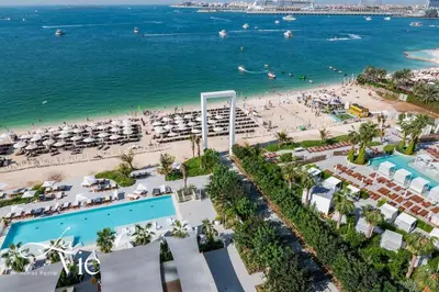 an aerial view of a beach and the ocean at La Vie, JBR - Exclusive Beach & Pool Access in Dubai