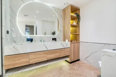 a bathroom with a large mirror and a tub at DAYF-FMT Fairmont Palm with Pool and Beach Access in Dubai