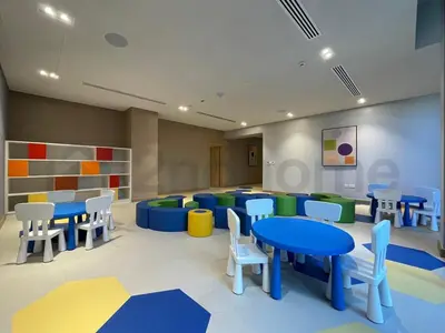 a classroom with tables and chairs in a room at Tourist Spot, Sea View - Next to Bluewaters & JBR in Dubai