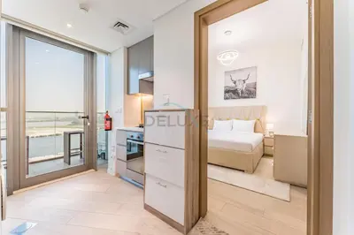 a bedroom with a bed and a view of the ocean at 1BR with Dubai Creek Views, Near Dubai Frame And Zabeel Park, Fawad Azizi Residence, Al Jadaf by Deluxe Holiday Homes in Dubai
