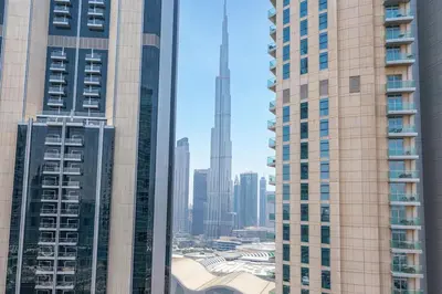 a view of a city skyline with tall buildings at 2min to Dubai Mall - Pool, Gym, Sauna - Full Burj View in Dubai