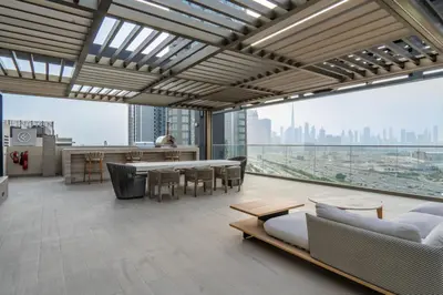 a large living room with a table and chairs at NEW 2 Bed w Rooftop Pool Panoramic Dubai Views in Dubai
