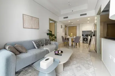 a living room with a couch and a table at Luxury Penthouse - Scenic View - Near Burj Khalifa in Dubai