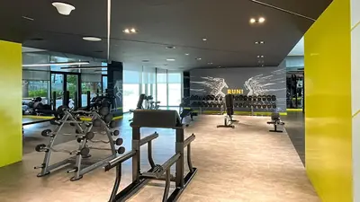 a gym with treadmills and ellipticals in a building at Luxury Penthouse - Scenic View - Near Burj Khalifa in Dubai
