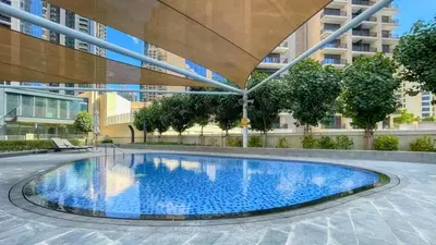 a swimming pool in the middle of a building at TRPS - BLVD Heights, Downtown Dubai - Luxury 1BR, Close to Dubai Mall in Dubai