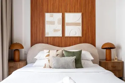 a bedroom with a bed with white sheets and pillows at GuestReady - Tasteful home in Dubai Creek Harbour in Dubai