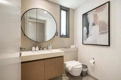 a bathroom with a sink and a mirror at Elegant 4BR Villa, Luxury Pool Retreat, Joy, Arabiana Ranches 3 in Sabkhah