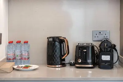 a counter top with a coffee maker and a toaster at Elegant 4BR Villa, Luxury Pool Retreat, Joy, Arabiana Ranches 3 in Sabkhah