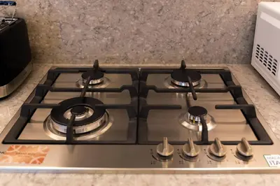a stove top oven in a kitchen at Ultra Luxury Apt | Private Beach + Infinity Pool in Dubai