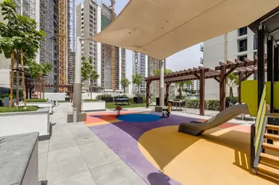 a playground in a city with tall buildings at GLOBALSTAY Elegant Meydan Apartments - Azizi Riviera 40 in Dubai