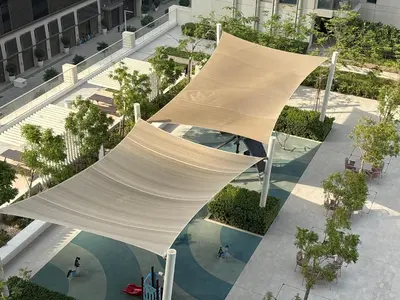 an overhead view of a building with a large white structure at Palm View Marina Vista 1BR Beachfront in Dubai