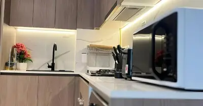 a kitchen with a microwave on a counter at Laya Heights Residence by Hogar in Dubai