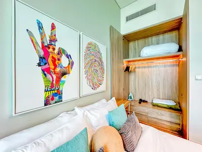 a bedroom with a bed and a bunk bed at Minimal Studio in Marina Sea View in Centric & Top Building in Dubai