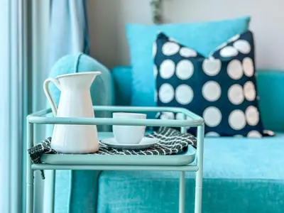 a tray with a vase and cups on a table at Minimal Studio in Marina Sea View in Centric & Top Building in Dubai
