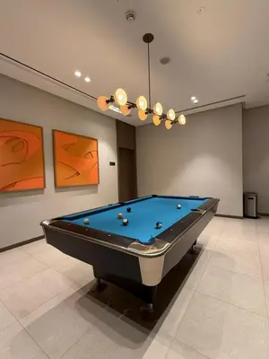 a billiard room with a pool table in it at Next to Burj Khalifa 5 Mins Walk To Dubai Mall in Dubai