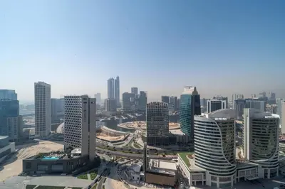 an aerial view of a city with tall buildings at Frank Porter - MADA Residences, Downtown in Dubai