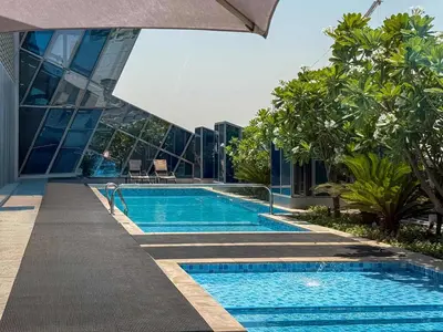 a swimming pool in front of a building at Frank Porter - J One Tower, Buisness Bay in Dubai