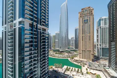 a view of a city with tall buildings and a river at Frank Poretr - MBL Royal, Jumeirah Lakes Towers in Dubai