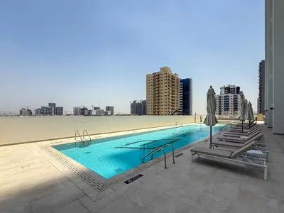 a swimming pool on the roof of a building at Frank Porter - Binghatti Tulip in Dubai
