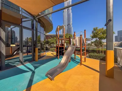 a playground in a building with a slide at Frank Porter - Grande Signature Residences in Dubai