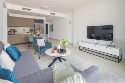 a living room with a couch and a table at Frank Porter - Burj Crown in Dubai