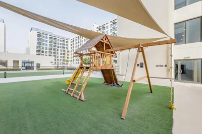 a playground with a ladder and a tent at Steps Away from Town Square Park Studio, Minutes Drive to Butterfly Garden, Liva Apartments, Town Square by Deluxe Holiday Homes in Dubai